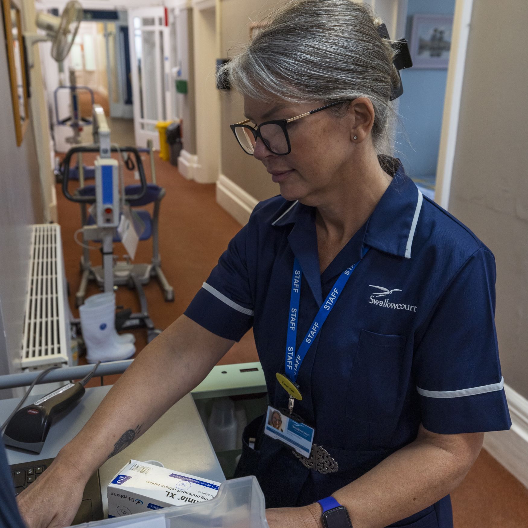 A female nurse sorting medication