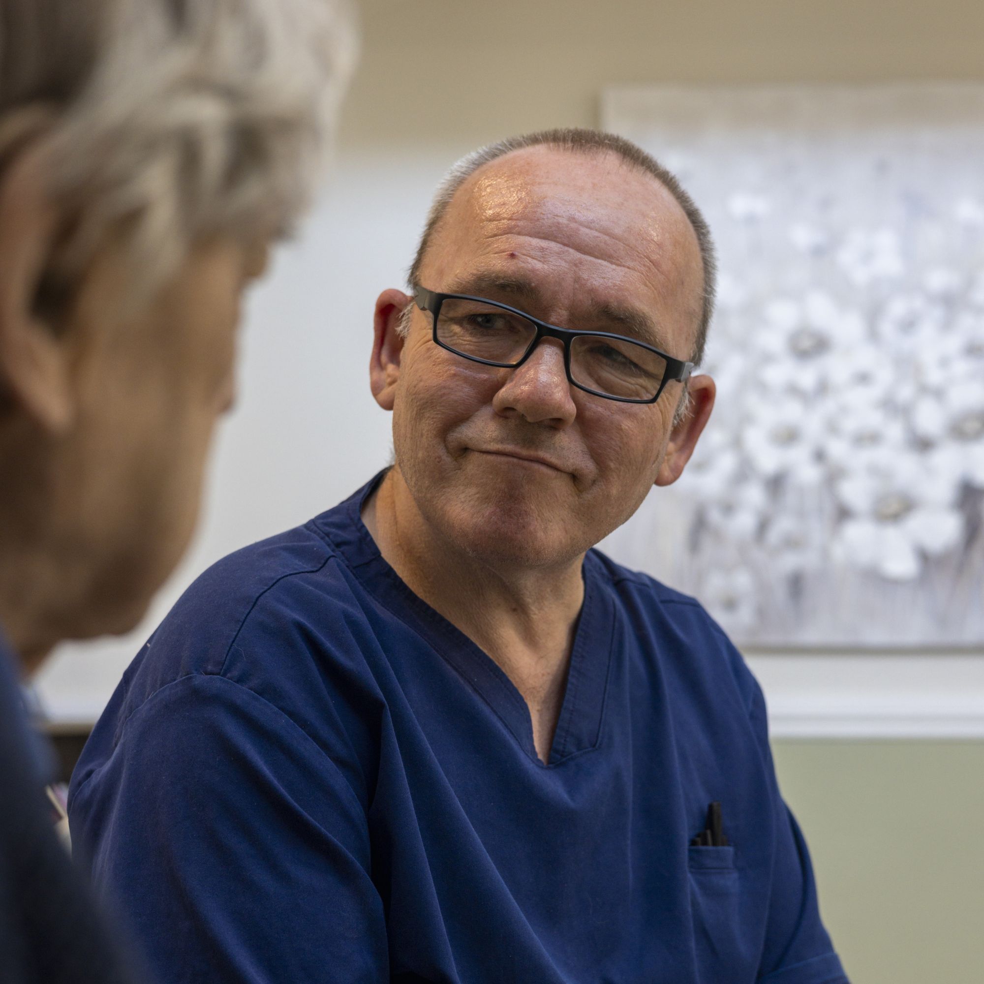 A man looking towards another person