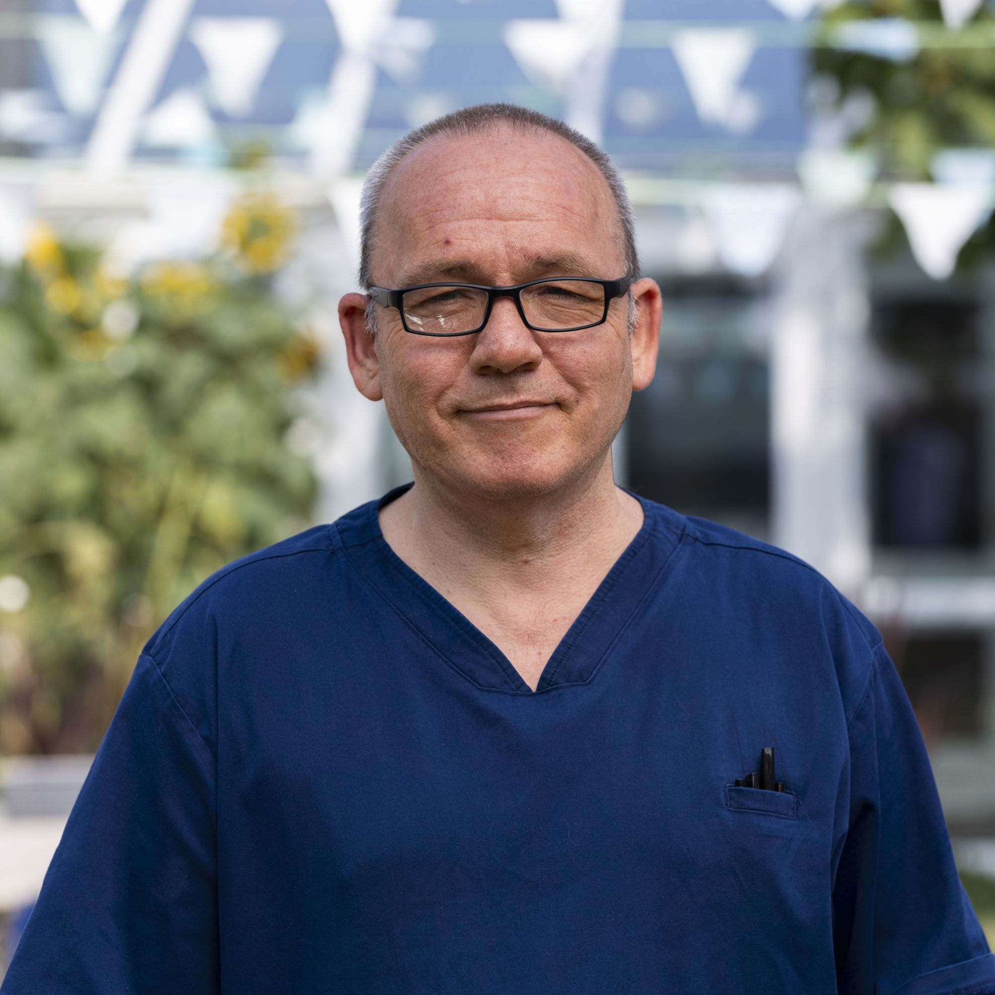 Portrait of a male nurse facing the camera smiling